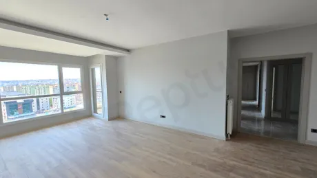 Geniş pencereli, ferah ve modern mimariye sahip 3+1 dairenin oturma odası alanı.