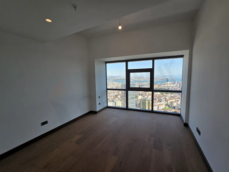 Şişli'deki lüks rezidans projesinde yer alan modern ve geniş tasarımlı bir yatak odası görseli.