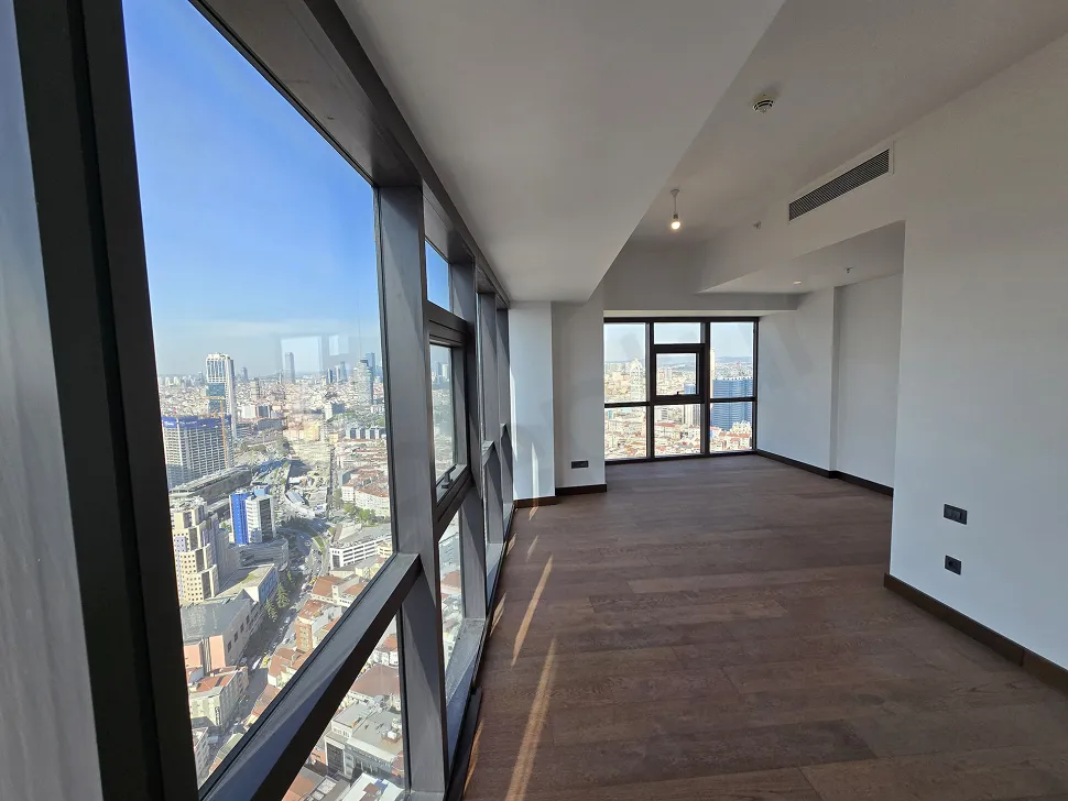 Şişli'de yer alan modern bir rezidans dairenin ferah ve aydınlık yatak odası görseli.